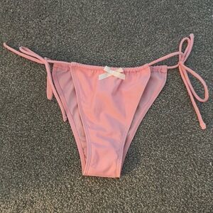 small pink bikini bottoms, white bow